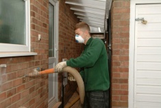 Cavity wall insulation being installed